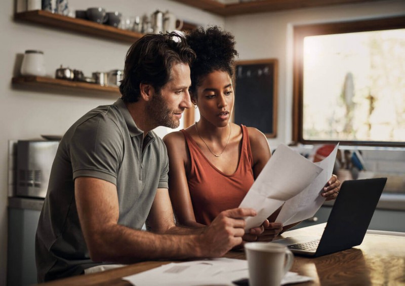A couple looking at their documents