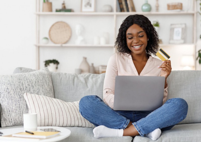 A happy woman shopping online