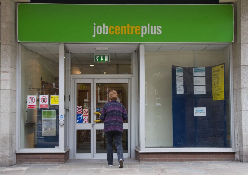A lady entering Job Centre Plus