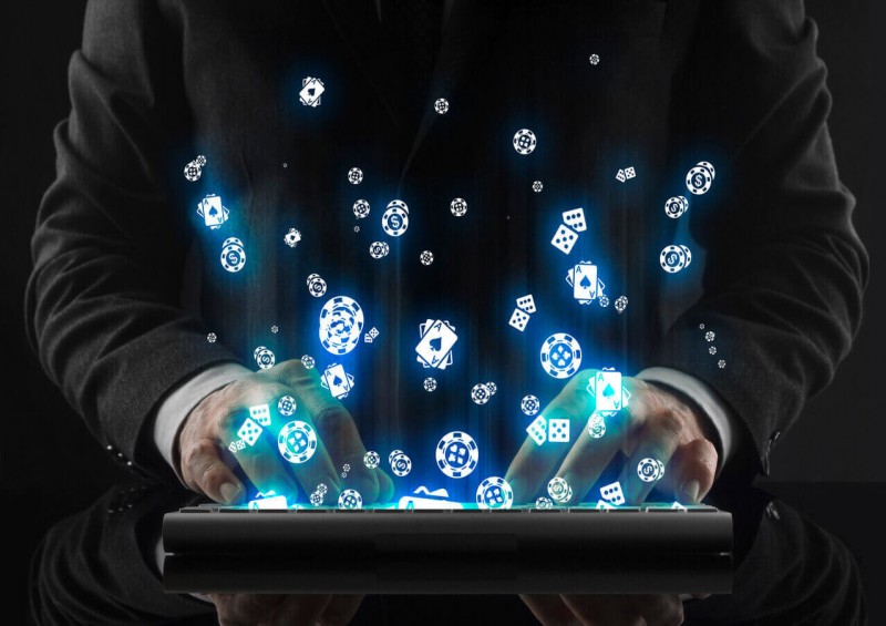 A man gambling on a computer