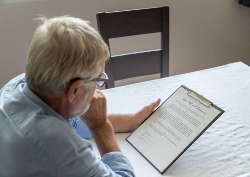 A man reading a last will and testament