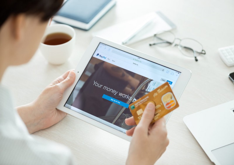 A person using PayPal on their tablet