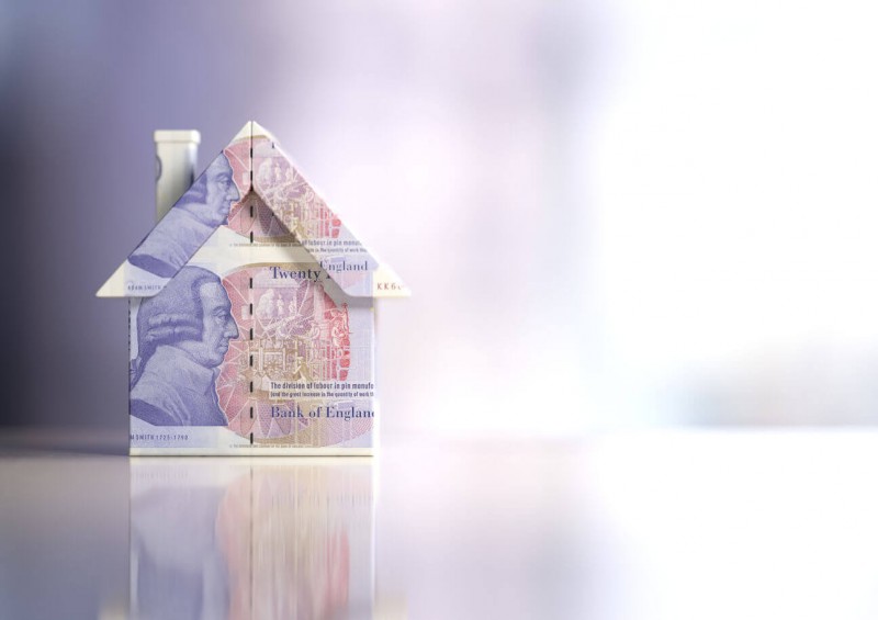A small house made of twenty pound notes