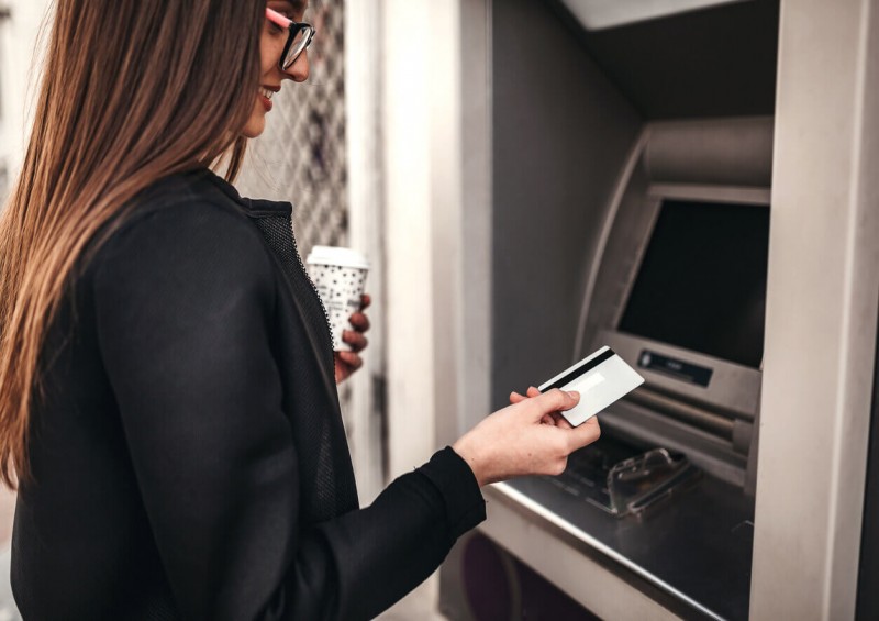 A student using an ATM machine