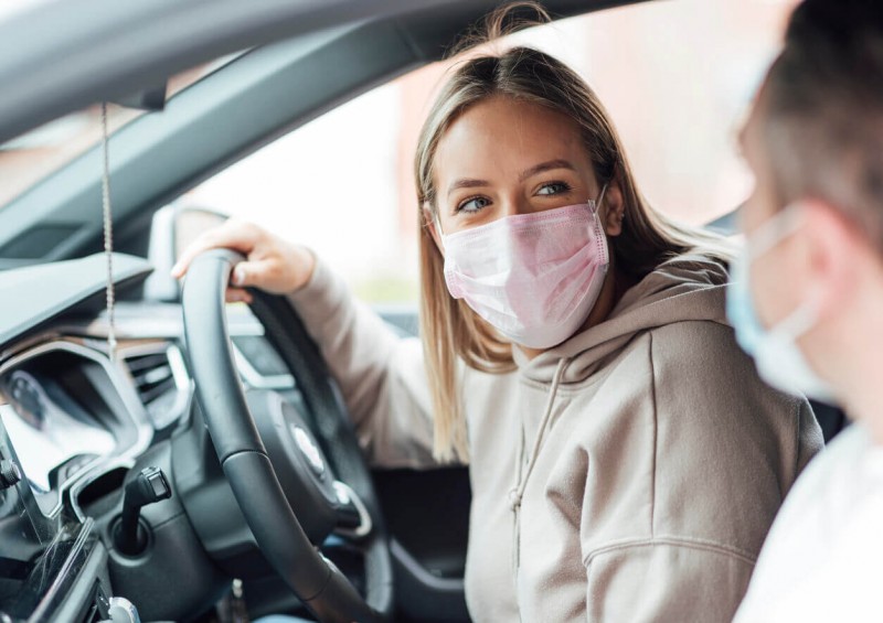 A young driver looking at the passenger