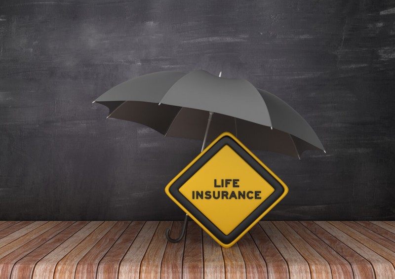 black umbrella over life insurnace sign