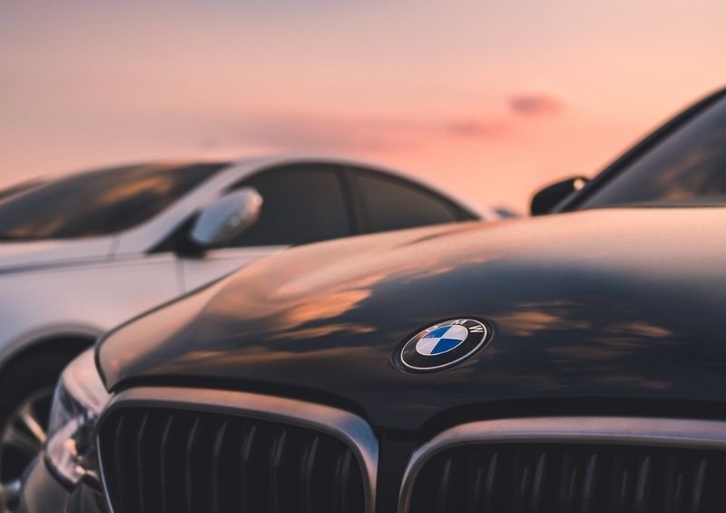 BMW vehicle with sunset