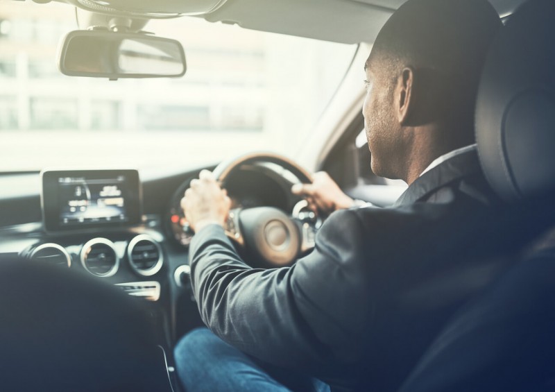 Business man commuting to work in his car