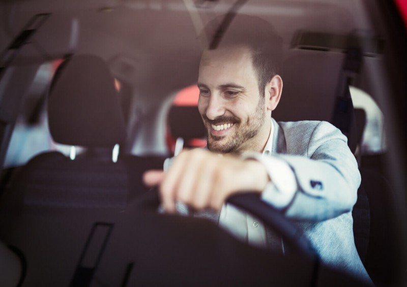 Business man starting his company car