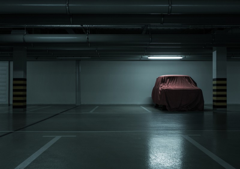 car covered up parked in dark car park