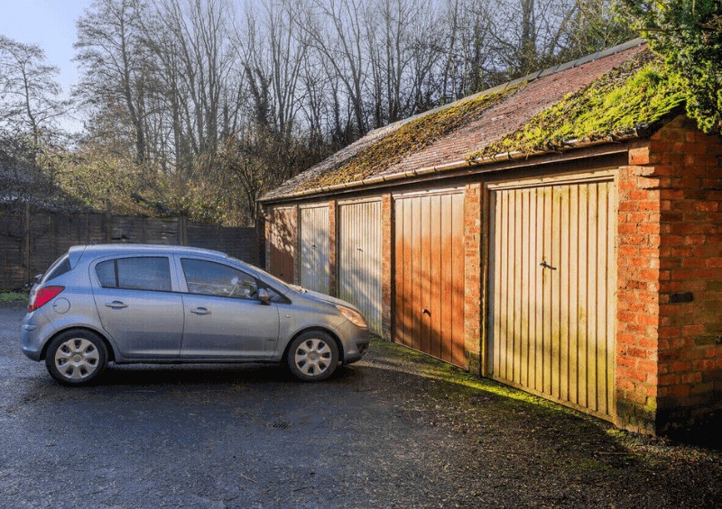 Car parked in front of garage