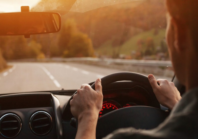 Close up of driver holding the steering wheel