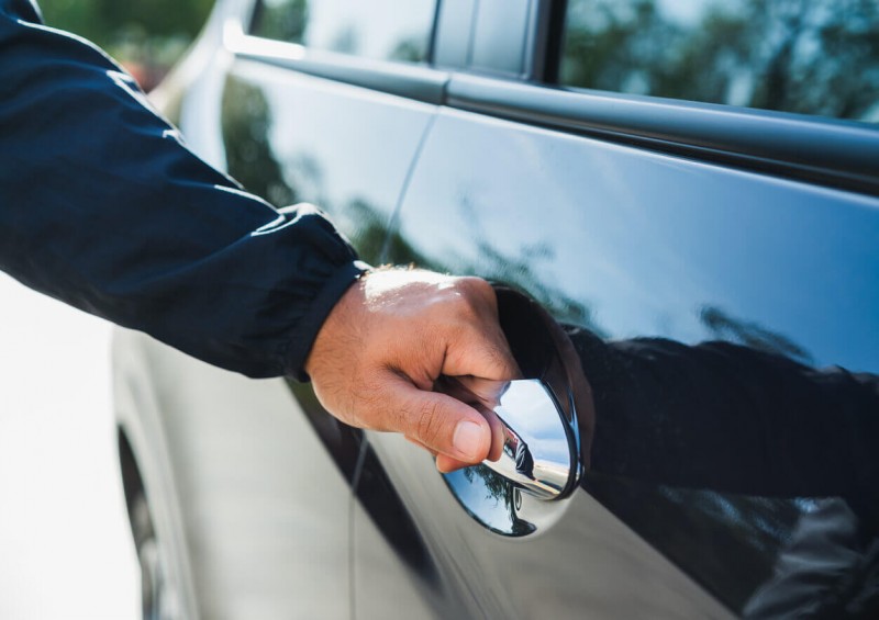 Close up of man opening new car door