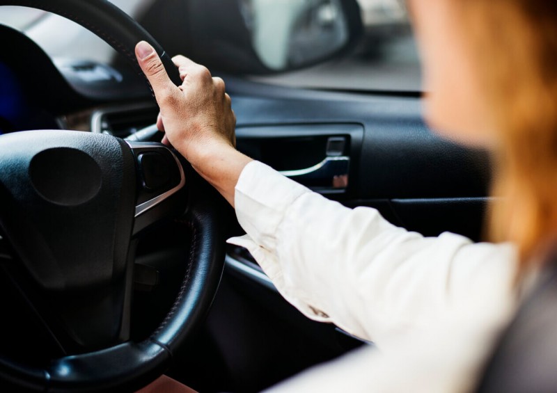 Close up of woman driving car