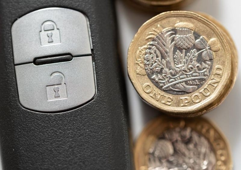 Coins next to car keys