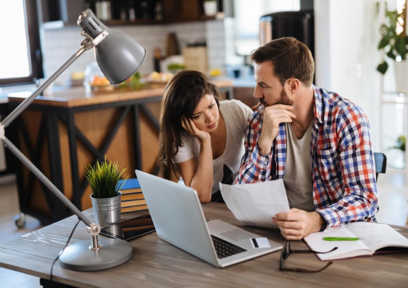 Couple looking at mortgage refusal letters