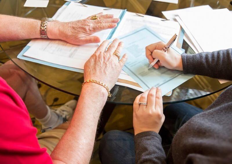 Couple signing a will