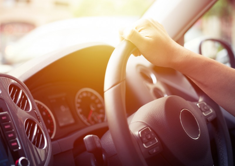 Driver s hand on steering wheel