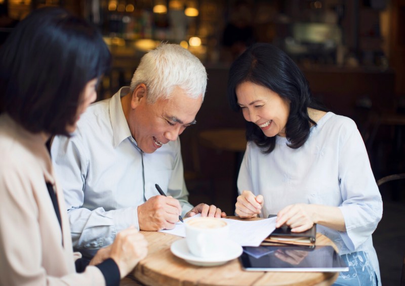 Elderly couple signing a Lasting Power of Attorney