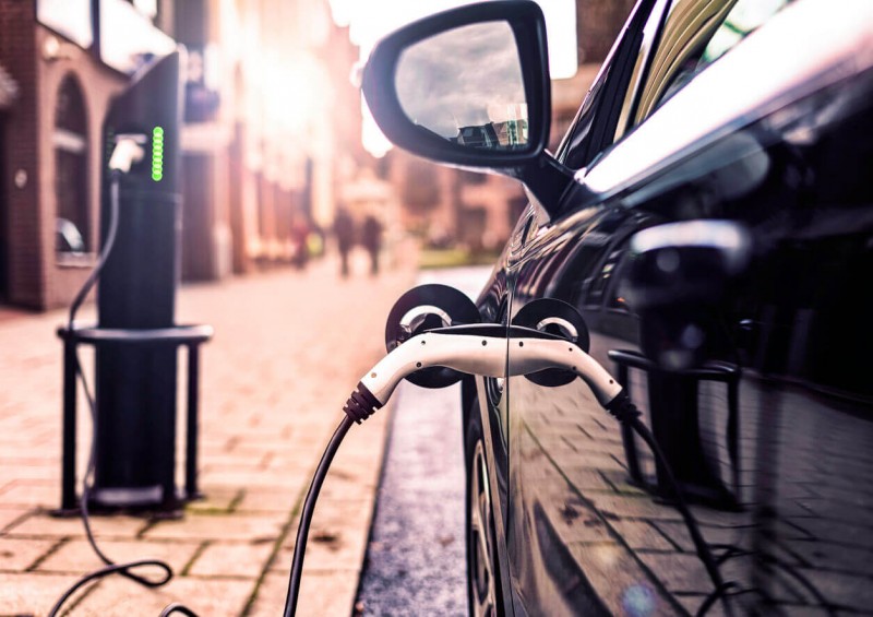 Electric car charging at station