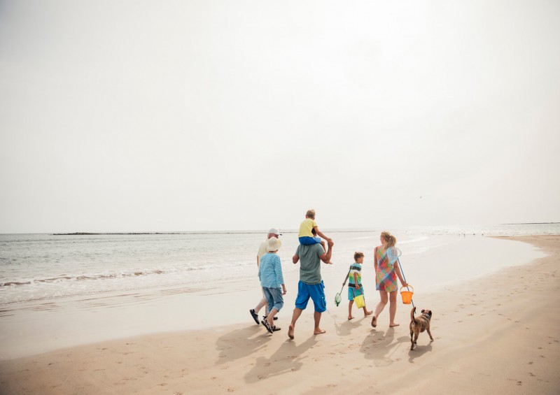 Family walking along the beach