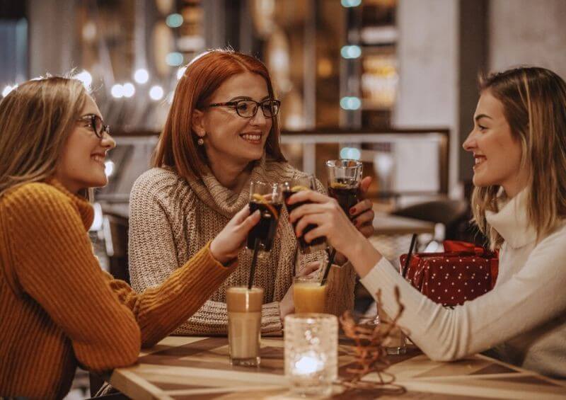 Friends enjoying a glass of coke