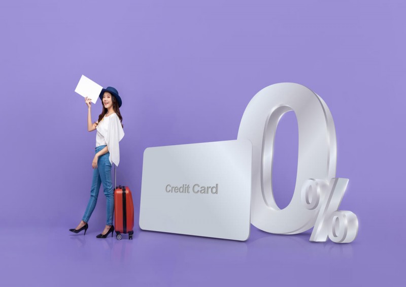 Giant 0 credit card next to woman