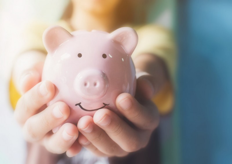 Girl holding piggy bank