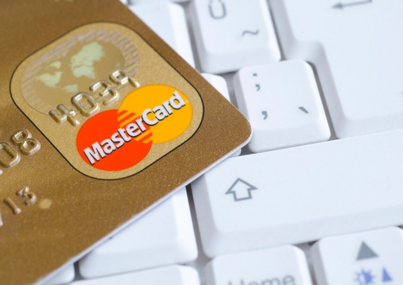 Gold MasterCard on computer keyboard