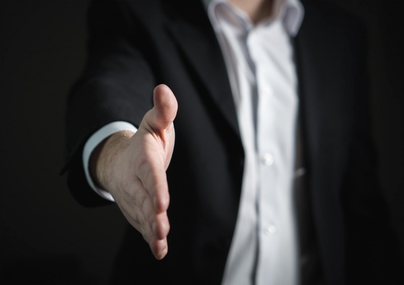 hand extended in offering