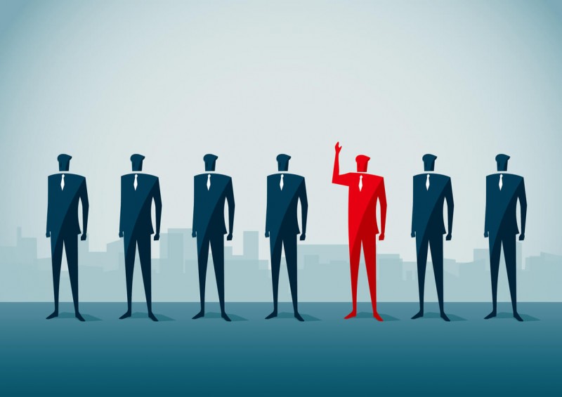 Illustration of one business man standing out among the rest
