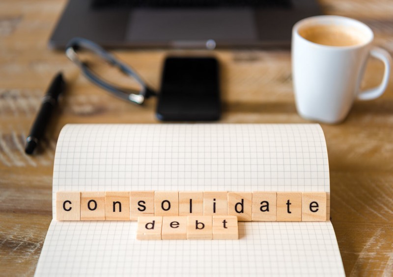 Image of notebook with the words consolidation debt on it