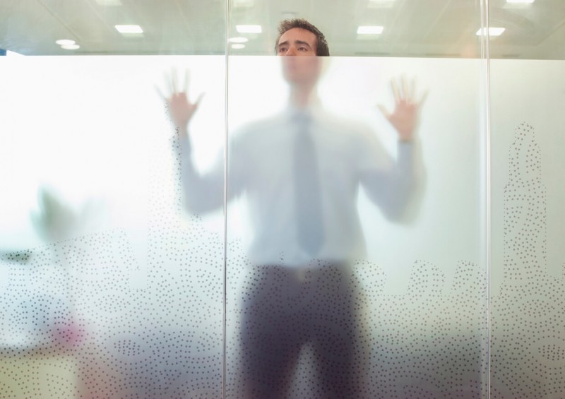man behind glass