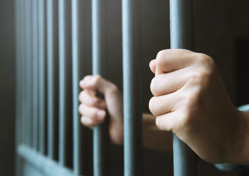 Man behind jail bars