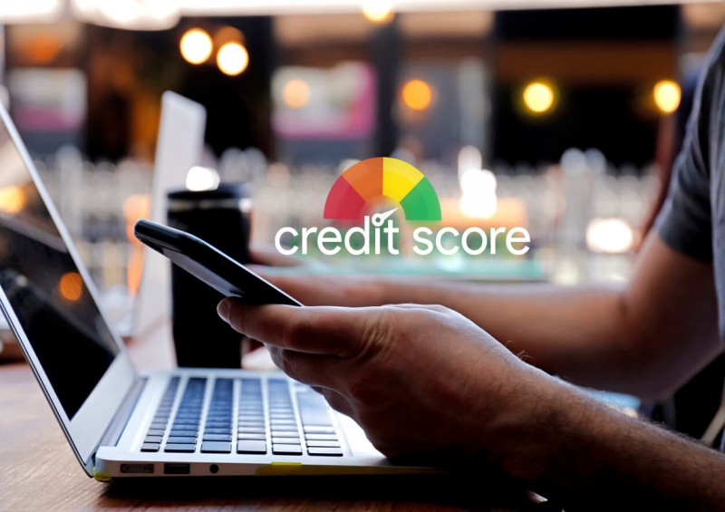 Man checking credit score on laptop