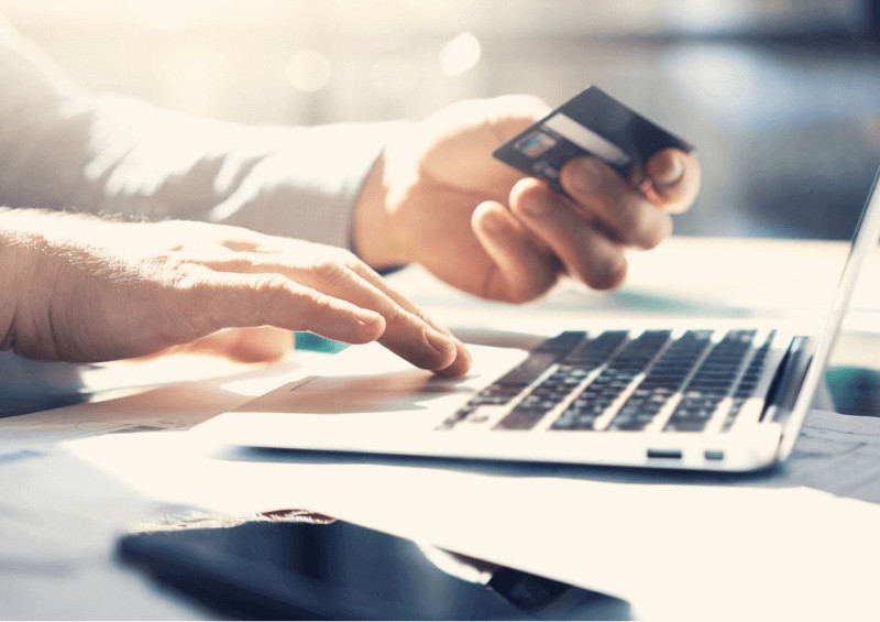 Man doing online banking on laptop