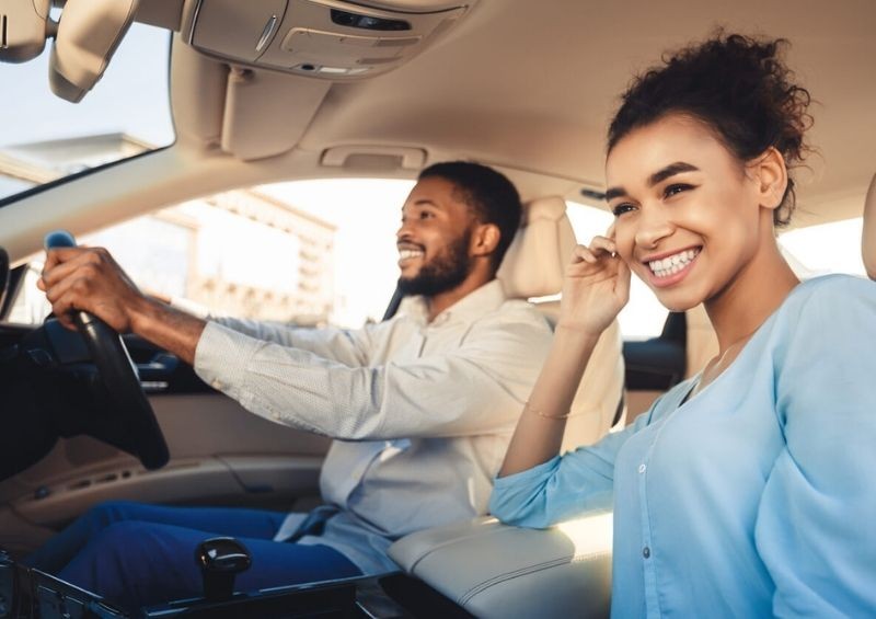 Man driving another car with his partner
