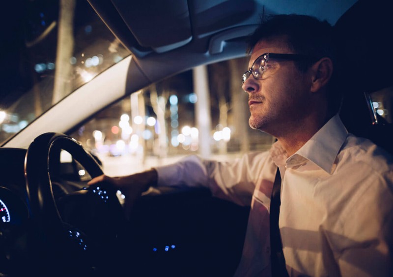Man driving at night