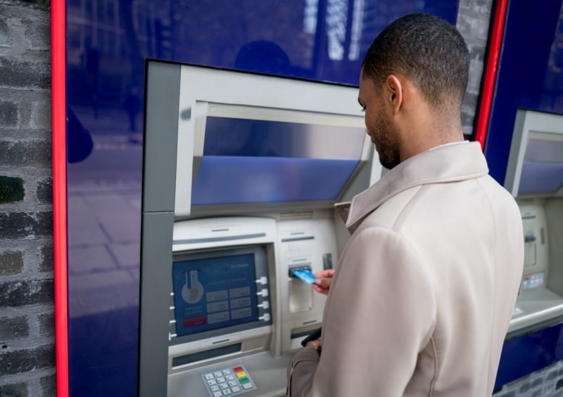 man using ATM