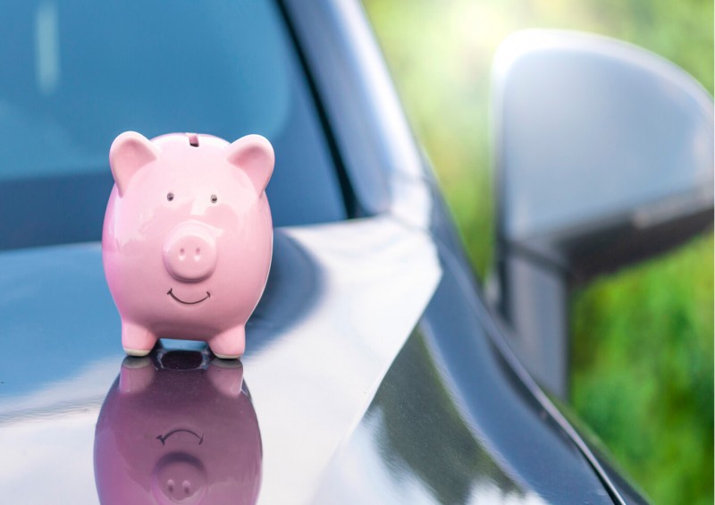 Money piggy bank on car