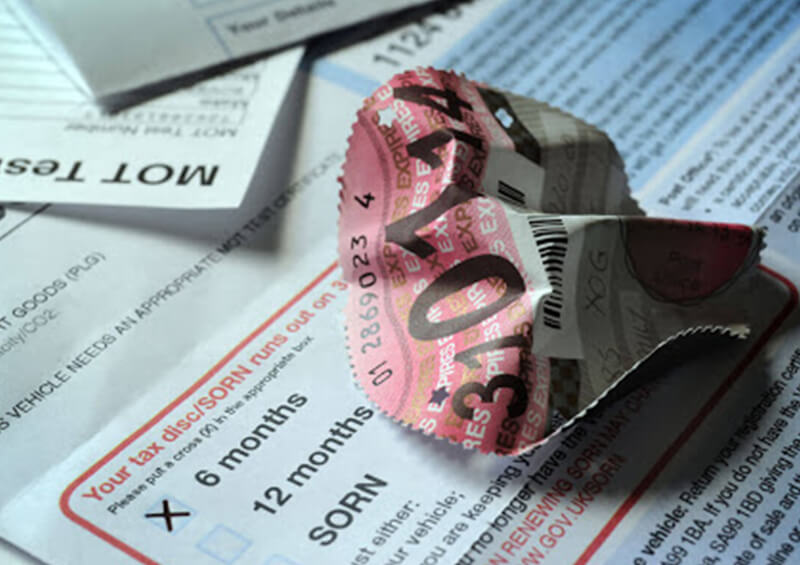 scrunched up car tax disc