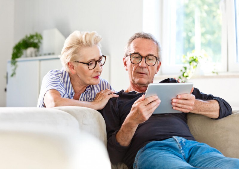 Older couple looking at their tablet together