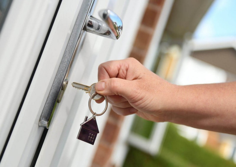 Opening front door to house
