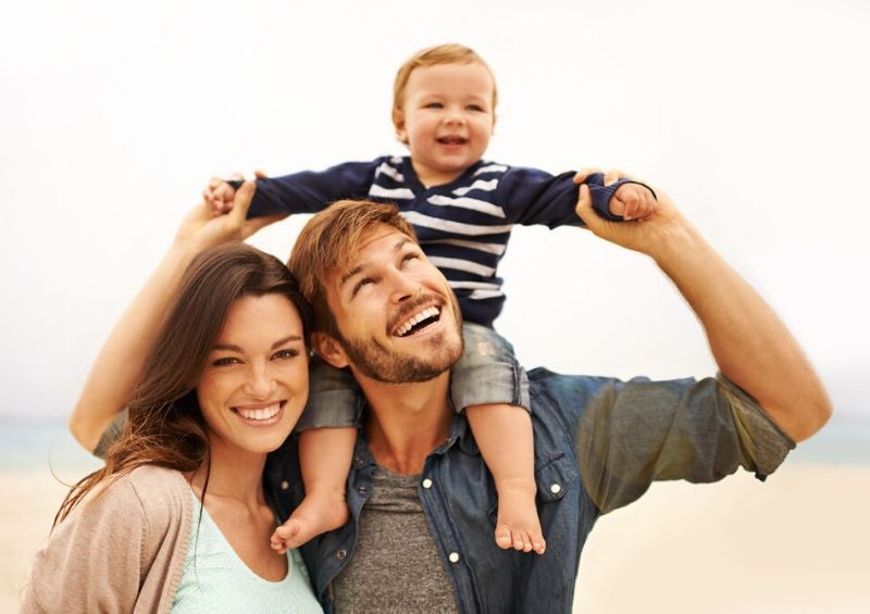 Parents with young child outdoors