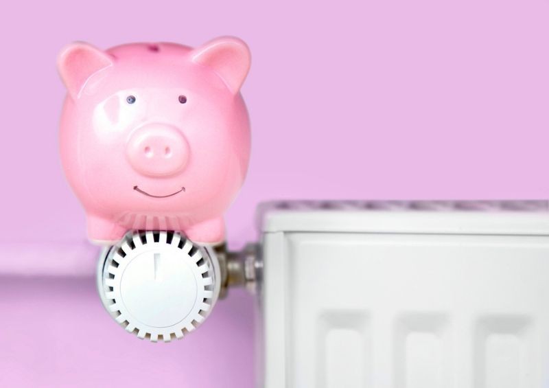 Piggy bank on a radiator