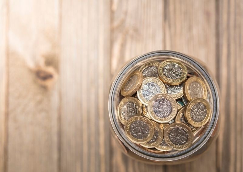 Pot of British one pound coins