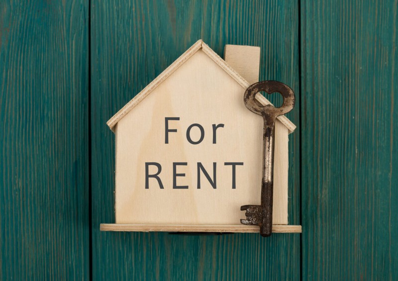 Small wooden house with for rent on the front