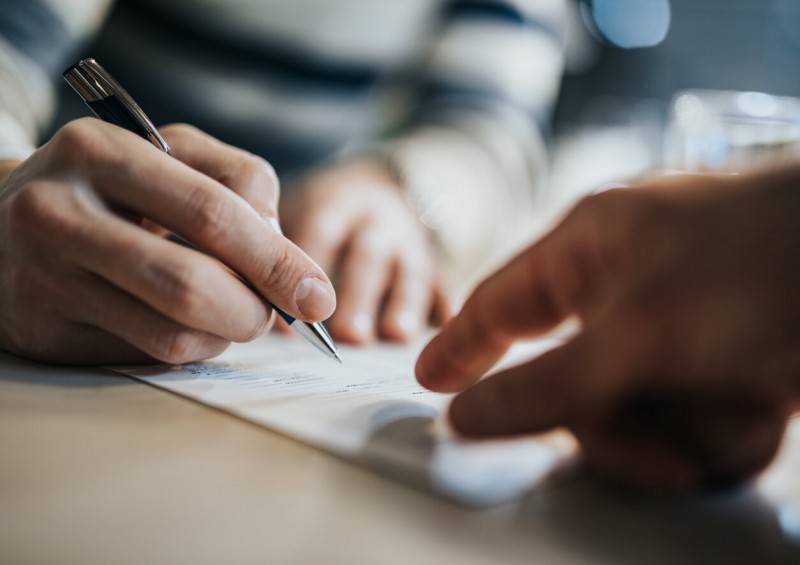 Someone signing trust contract