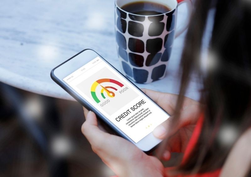 Woman checking credit score on mobile for free