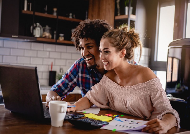 Young couple researching loans